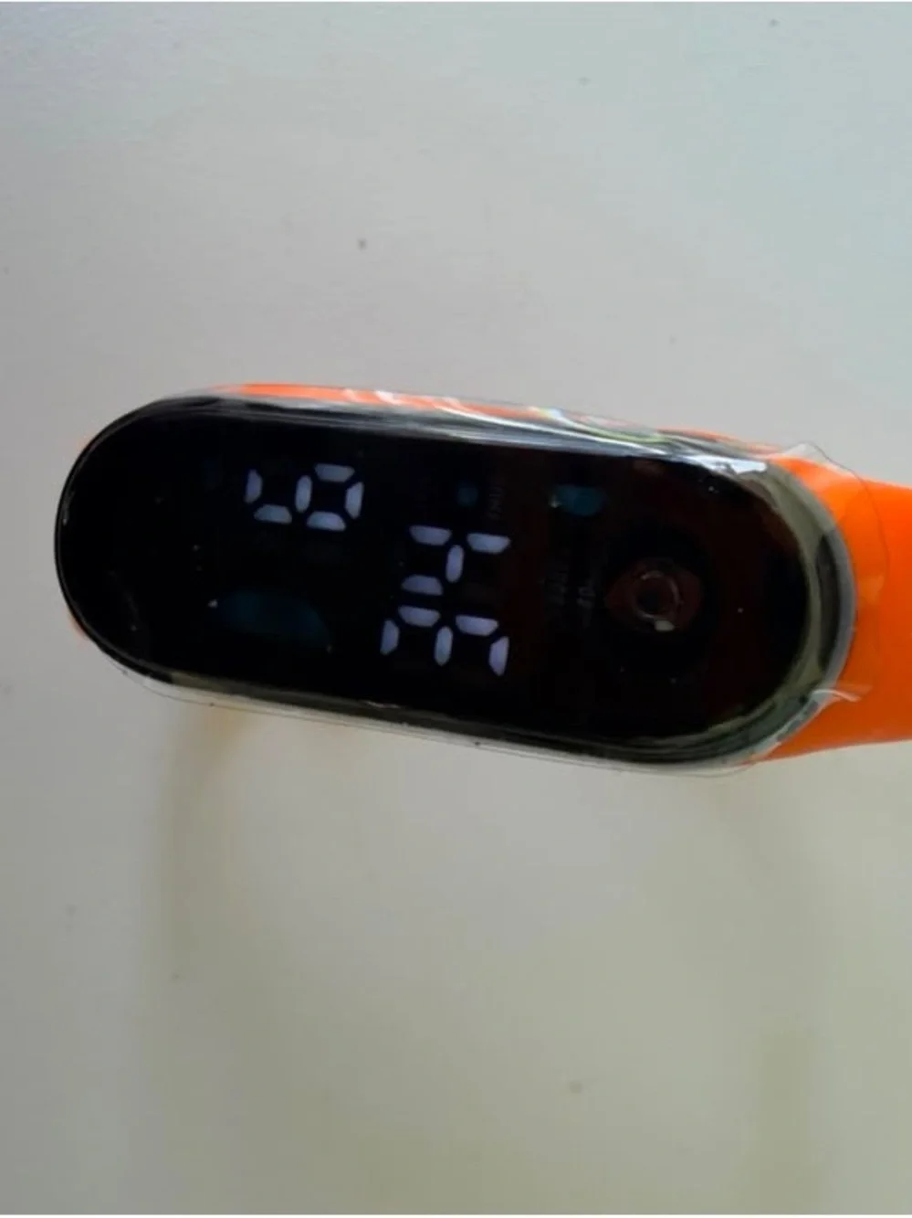 Replaceable Orange Silicone Smartwatch Band with Black Tracker Module
